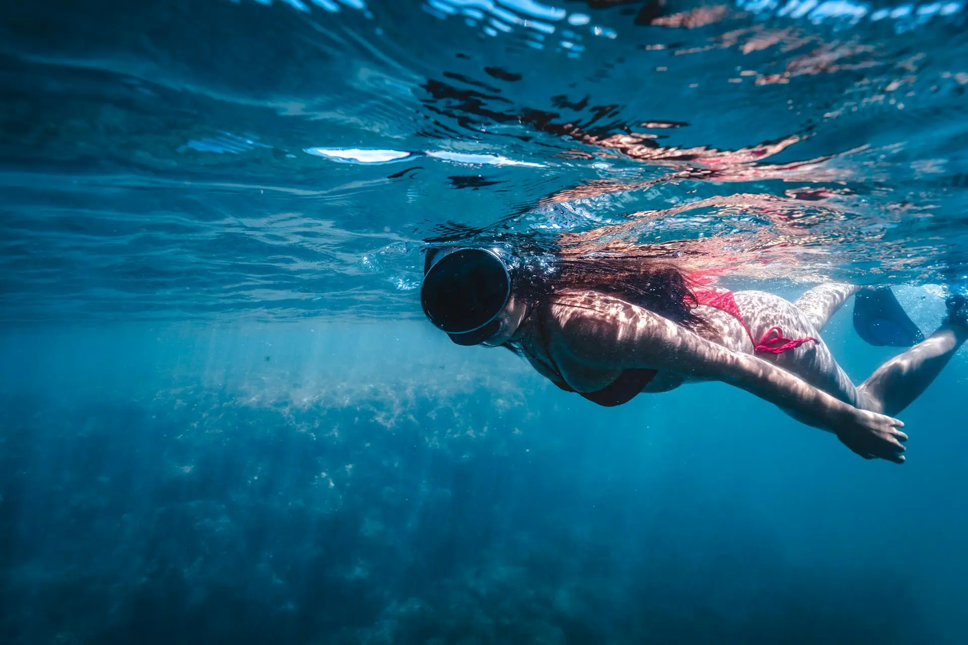 Snorkeler exploring the rocky reef at Biesanz Bay near Manuel Antonio National Park, Costa Rica